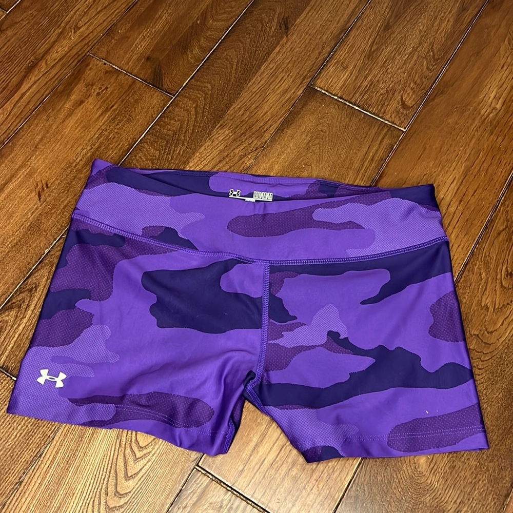 Purple camo Under Armour compression shorts.